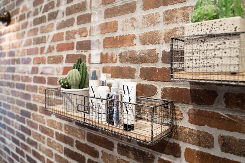 shampoos and creams arranged on a stand